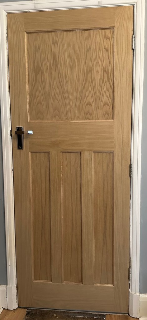 A photograph of the Nostalgia DX 1930s replica internal door in American white oak - unstained and unvarnished.