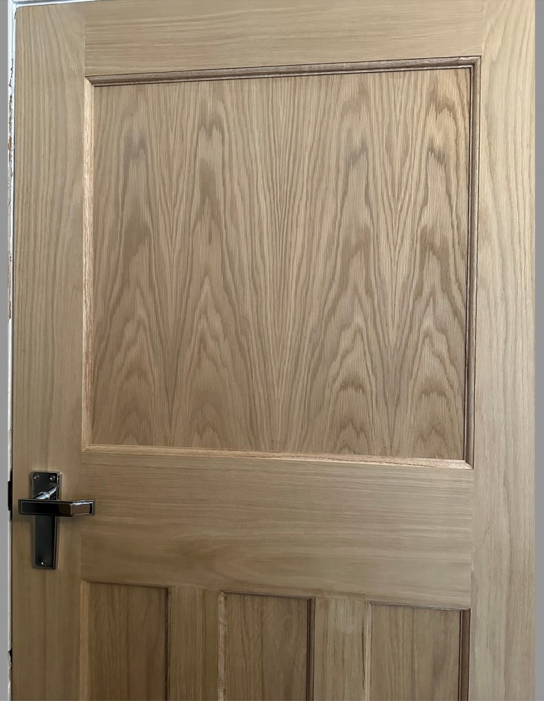 A photograph in closer detail of the Nostalgia DX 1930s replica internal door in American white oak - unstained and unvarnished.